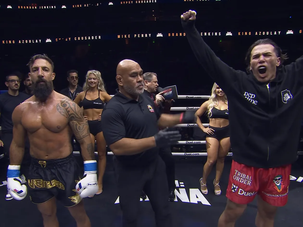 The referee raises Paul Miller's arm after the split-decision win over Ben King Azoulay at Duel: Arena 1 in Orlando